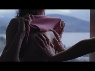 attenberg 2010. girl looking and touching her friend's breasts